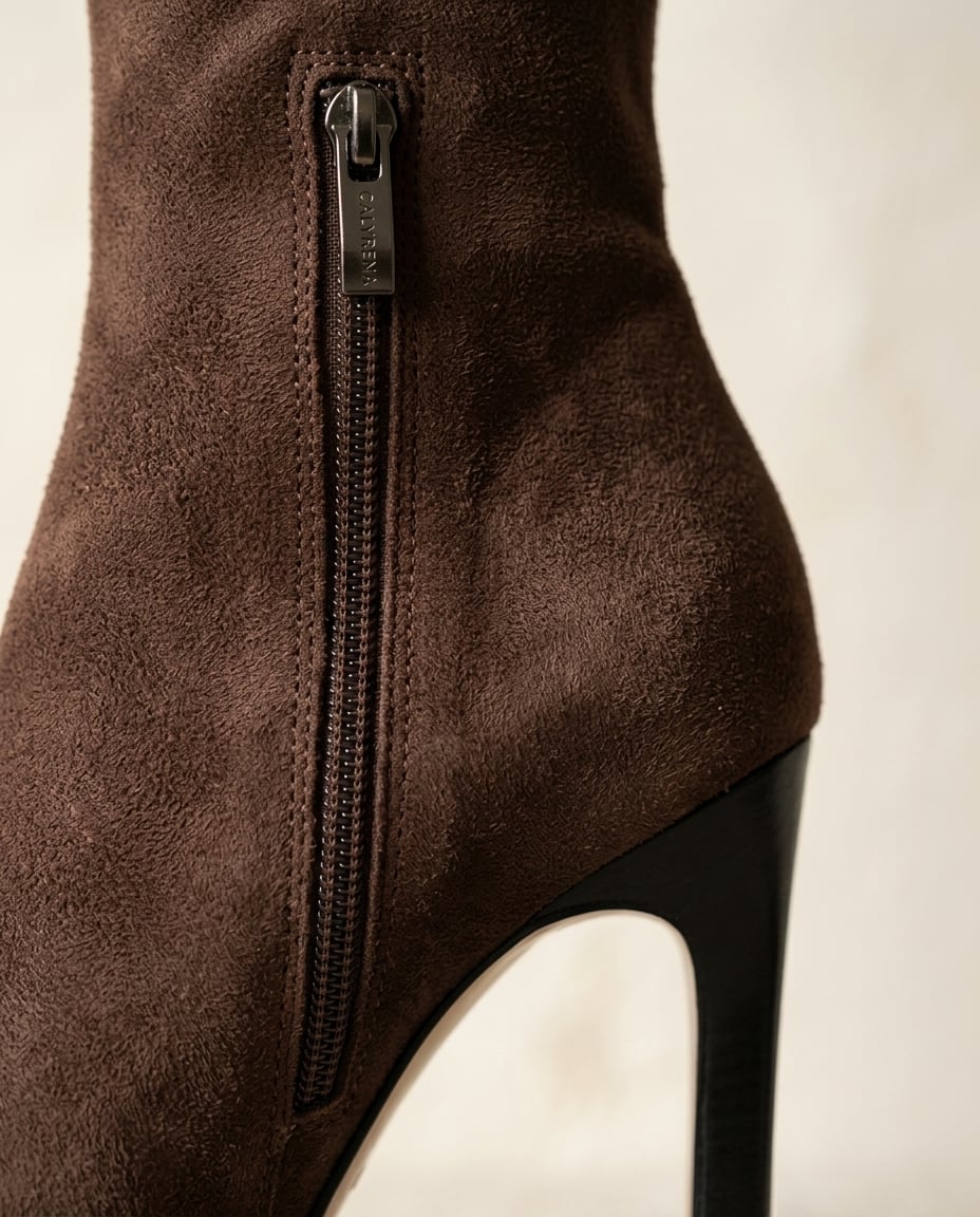 Brown over-the-knee boots material and heel detail | Maison Perigee — detail