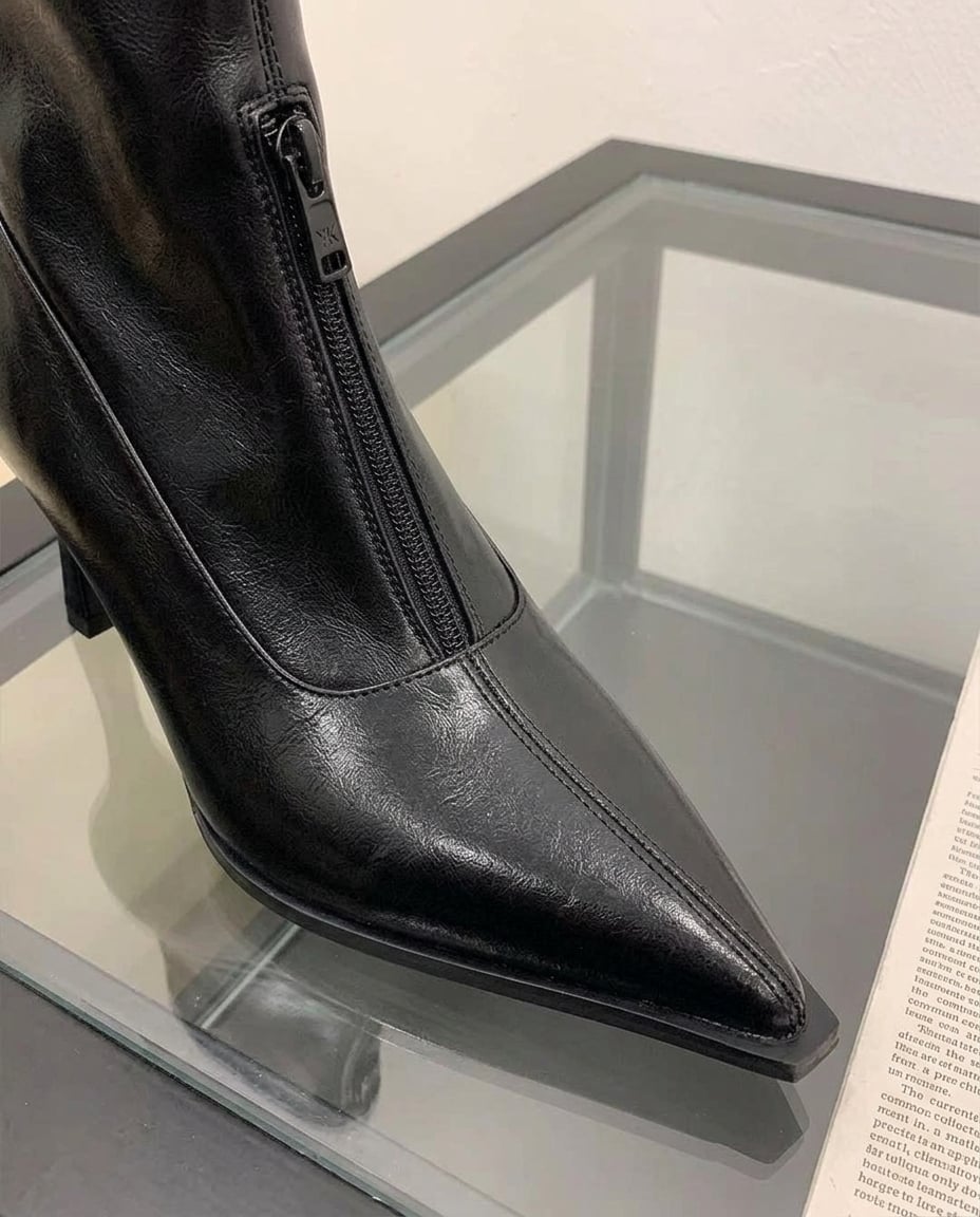 Black ankle boots material and heel detail | Maison Perigee — detail