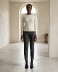 Black ankle boots on model, front view | Maison Perigee — front