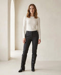Black knee-high boots on model, front view | Maison Perigee — front
