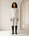 Black knee-high boots on model, front view | Maison Perigee — front
