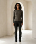 Black knee-high boots on model, front view | Maison Perigee — front